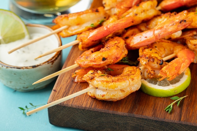 Photo grilled shrimp skewers or langoustines.