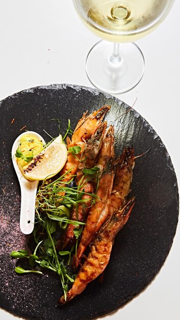 Grilled shrimp skewers Seafood shelfish Shrimps Prawns skewers with herbs garlic and lemon