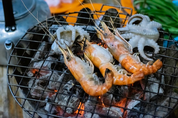 Grilled shrimp and squid on hot charcoal