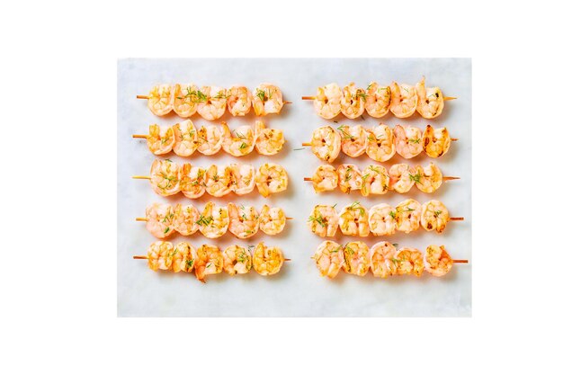 Grilled shrimps kebabs and on the white plate