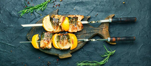 Grilled skewers of mackerel with lemon.Grilled fish kebab