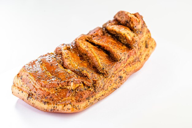 Grilled smoked lard, whole bacon with skin, lard and meat, lies on a white isolated background