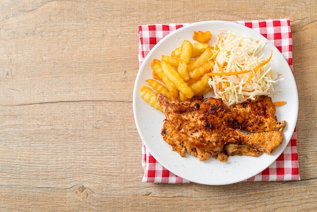 grilled spicy barbecue chicken steak with french fries