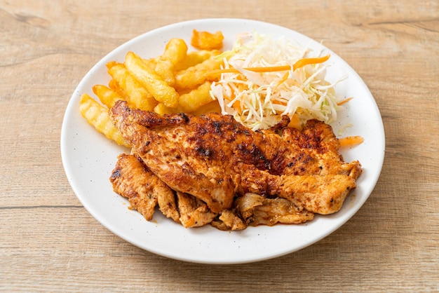 grilled spicy barbecue chicken steak with french fries