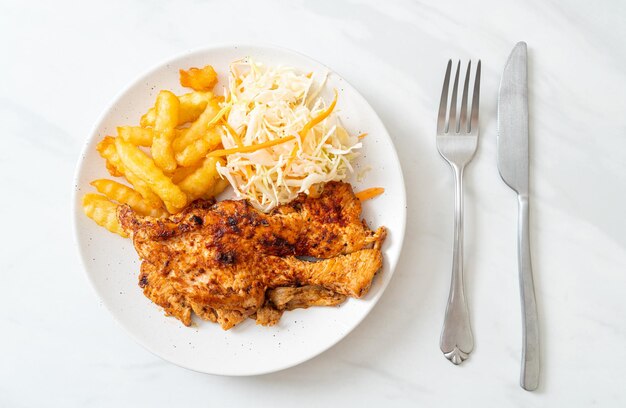 grilled spicy barbecue chicken steak with french fries