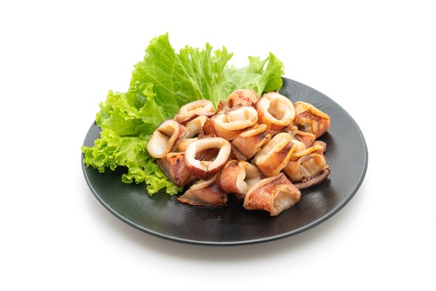 grilled squid on black plate