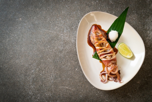 grilled squid with teriyaki sauce on plate