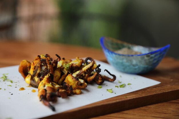 Grilled squid on wood background , Thai food