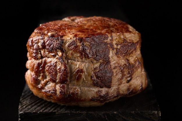 Grilled steak meat on the wooden surface