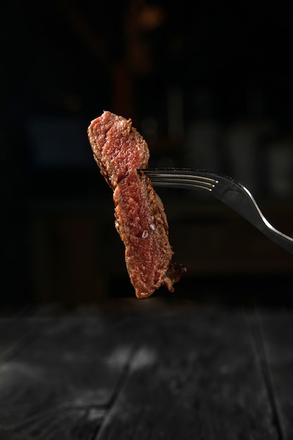 grilled steak on a white round plate