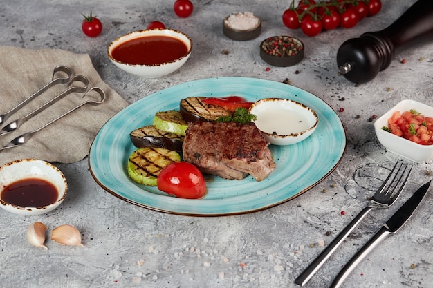 Grilled steak with zucchini on a plate