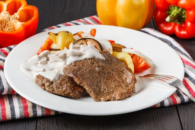 Grilled steaks and vegetable salad