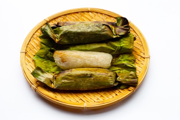 Grilled sticky rice in banana leaves with banana filling