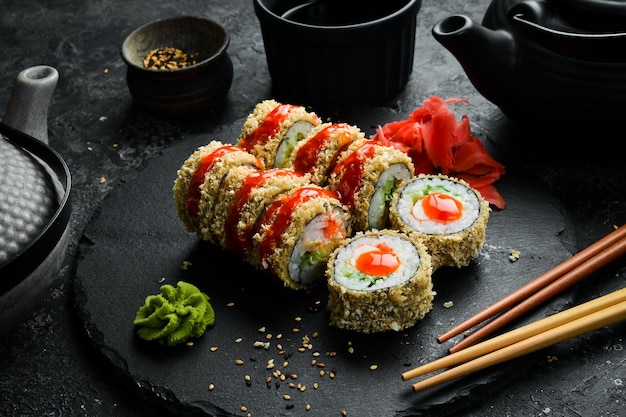 Grilled sushi rolls with salmon and eel on black background Sushi menu Japanese food