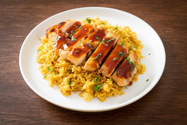 grilled sweet and chilli chicken with curry rice on plate