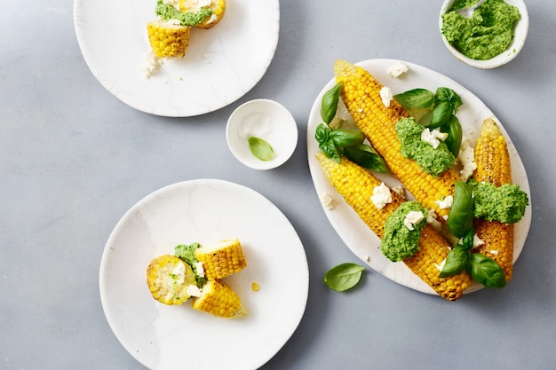 Grilled sweet corn with pesto top view