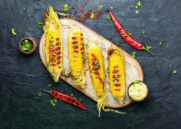 Grilled sweet corn with sauce and spicy.Summer vegan snack