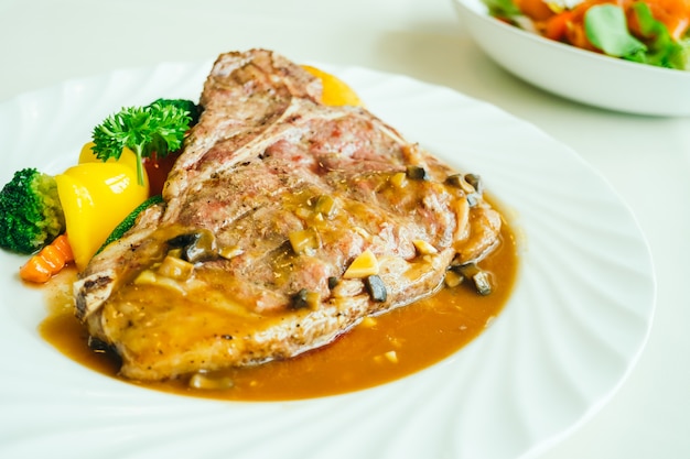 Grilled t-bone beef meat steak with vegetable