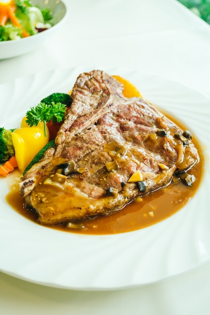 Grilled t-bone beef meat steak with vegetable