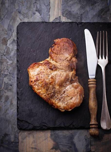 Photo grilled t-bone steak. selective focus