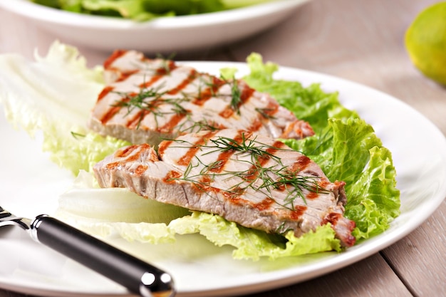 Grilled tuna with salad on a plate ready to eat