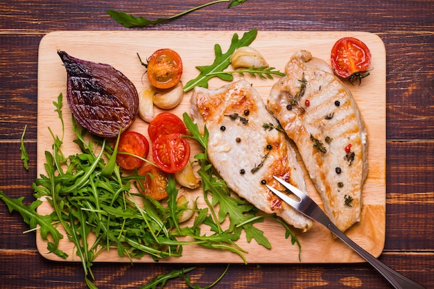 Grilled turkey steak on a cutting board