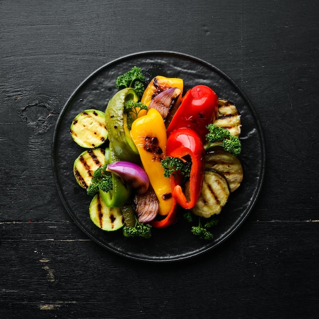 Grilled vegetables. Paprika, onion, eggplant, zucchini. Top view. Free space for your text.