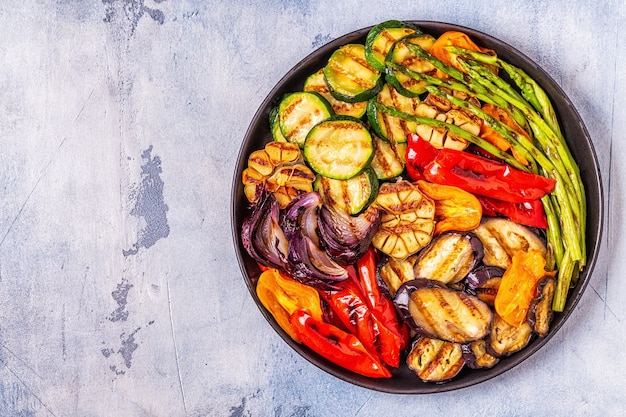 Grilled vegetables on a plate with sauce