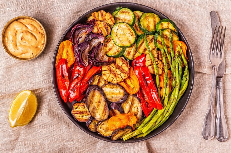 Grilled vegetables on a plate with sauce