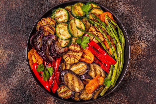 Grilled vegetables on a plate with sauce