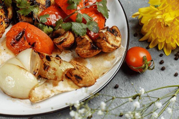 Grilled vegetables on a white plate. Grilled fresh vegetables.