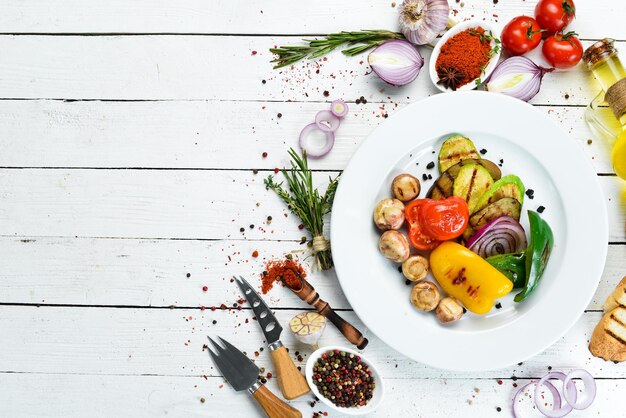 Grilled vegetables zucchini tomatoes paprika onion Top view Free space for your text