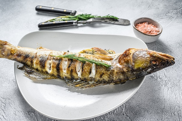 Grilled Zander, walleye fish with herbs and lemon