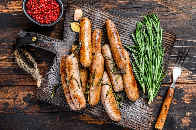 Grilling bavarian sausages on a cutting board