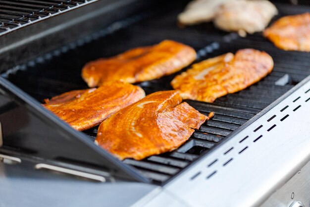 Grilling cod for fish tacos on outdoor gas grill.