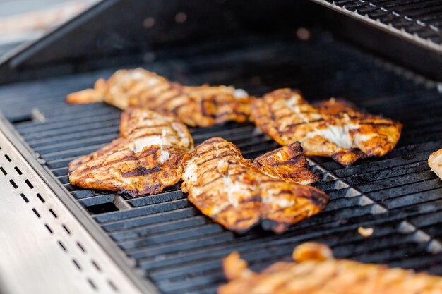 Grilling cod for fish tacos on outdoor gas grill.