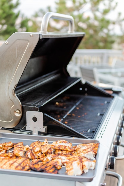 Grilling cod for fish tacos on outdoor gas grill.