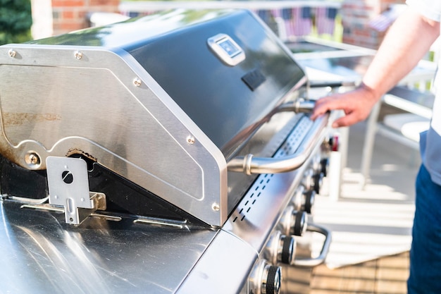 Grilling outdoor on a gas burning grill on the backyard\
patio.