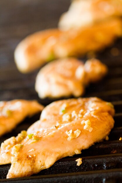 Grilling seasoned chicken for chicken fajitas.