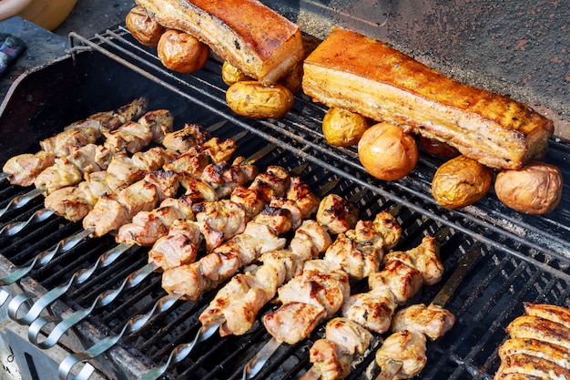 Grilling shashlik on barbecue grill.