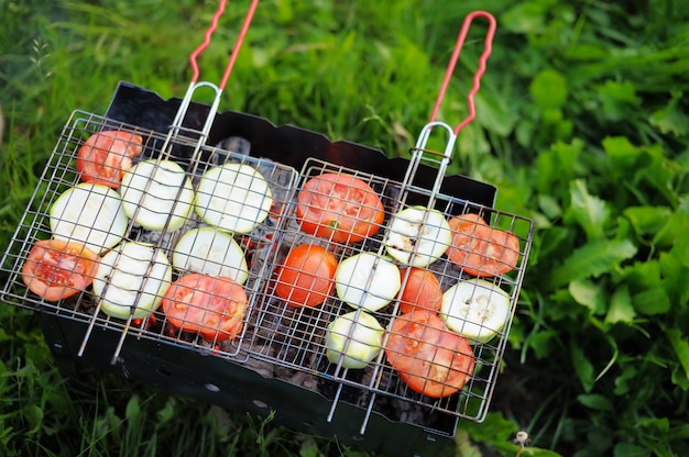 Grilling vegetables on pans, bright photo