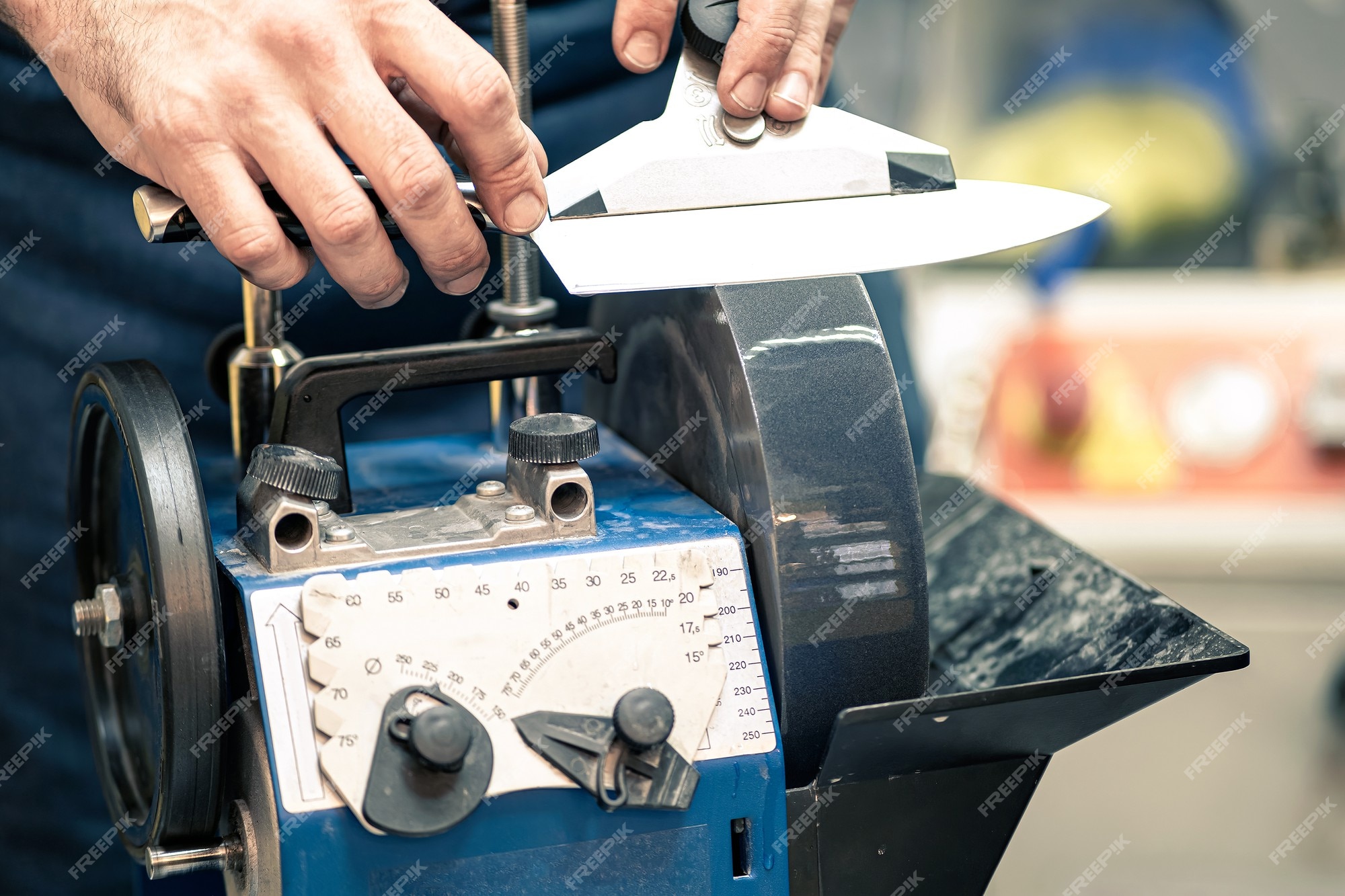 Premium Photo  Grindstone close-up. electric knife sharpening machine.