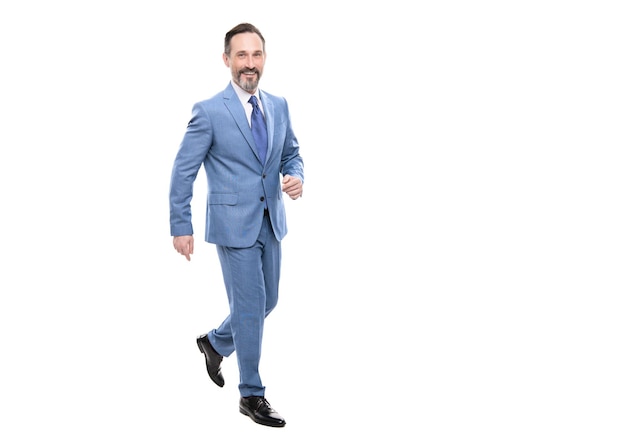 Grizzled happy walking bearded ceo. confident boss with graying hair. copy space. businessman full length. business success. successful man in suit. entrepreneur isolated on white. formal fashion.