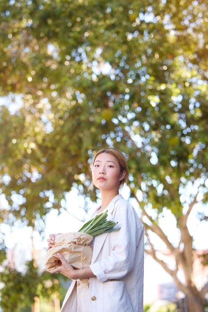 Grocery bag vegetable shopping and woman from Korea portrait with mockup and market food Health green vegetables and Korean person with eco friendly natural and diet nutrition grocery shopping