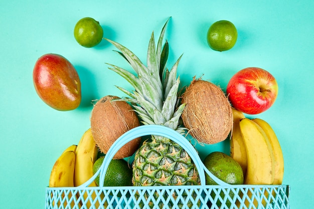 Grocery shopping bag with organic exotic fruits.