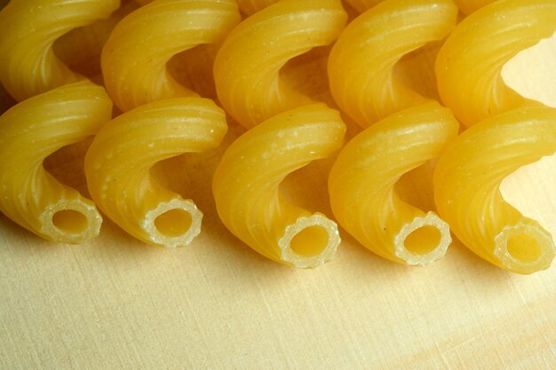 Grocery yellow background large raw rolled egg pasta