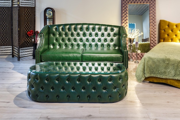 Grodno belarus december 2018 green sofa in chester style for
elite loft interior in expensive store showroom of furniture