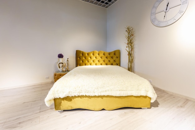 Grodno belarus december 2018 yellow bed in chester style for
elite loft interior in expensive store showroom of furniture