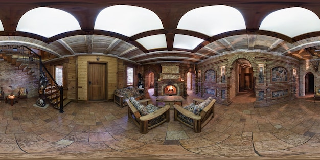 Grodno belarus december 21 2016 panorama in interior guest hall\
vacation house in medieval style with fireplace full 360 by 180\
degree seamless spherical panorama in equirectangular\
projection