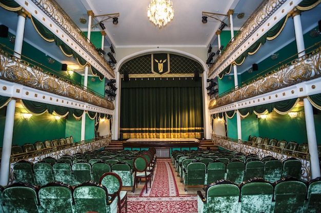 GRODNO BELARUS JULY 2018 Interior of conference concert hall or theatre with scene and green seats